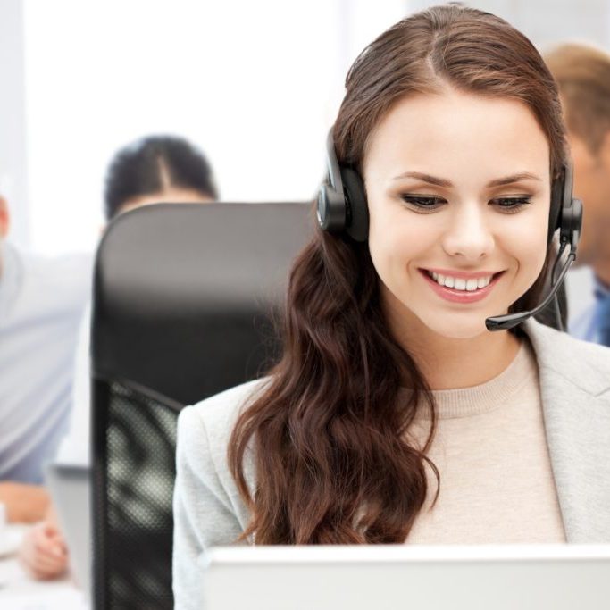 21574212 - business, technology and call center concept - helpline operator with headphones in call centre